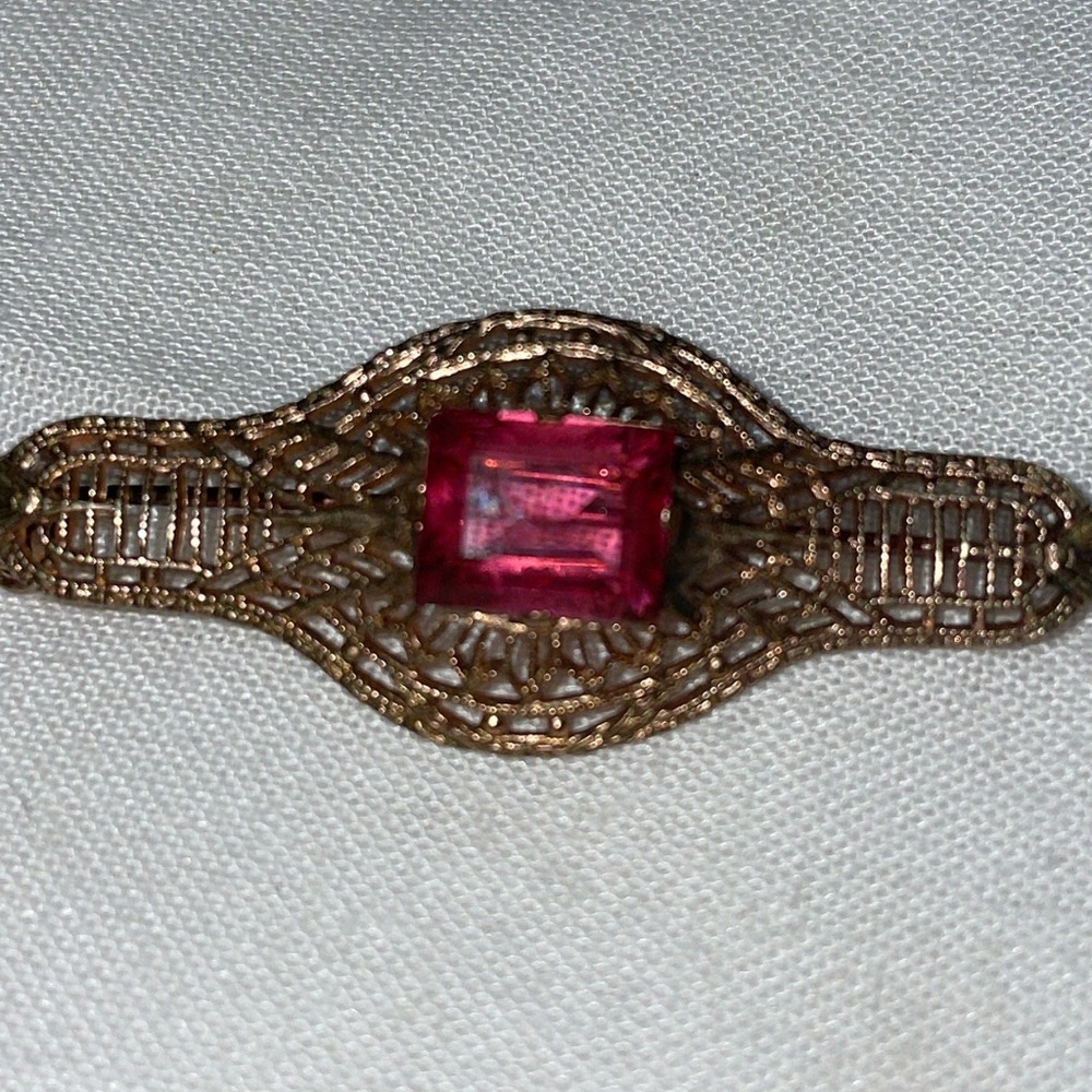 Antique gold tone cut out Art Deco pink emerald cut stone (gemstone?)brooch